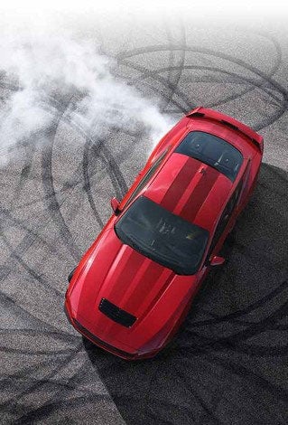 Overhead view of a 2024 Ford Mustang® model with tire tracks on pavement | Pinnacle Ford in Nicholasville KY